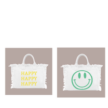 Load image into Gallery viewer, HAPPY HAPPY HAPPY TOTE MED BAG IS PERFECT FOR OCCASIONS. HAPPY FACE ON ONE SIDE AND GRAPHIC HAPPY HAPPY HAPPY ON THE OTHER SIDE. FRESH CREAM COLOR WILL GIVE LIFE TO ALL SUMMER OUTFITS AND SWIN SUITS
