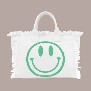 HAPPY HAPPY HAPPY TOTE MED BAG IS PERFECT FOR OCCASIONS. HAPPY FACE ON ONE SIDE AND GRAPHIC HAPPY HAPPY HAPPY ON THE OTHER SIDE. FRESH CREAM COLOR WILL GIVE LIFE TO ALL SUMMER OUTFITS AND SWIN SUITS